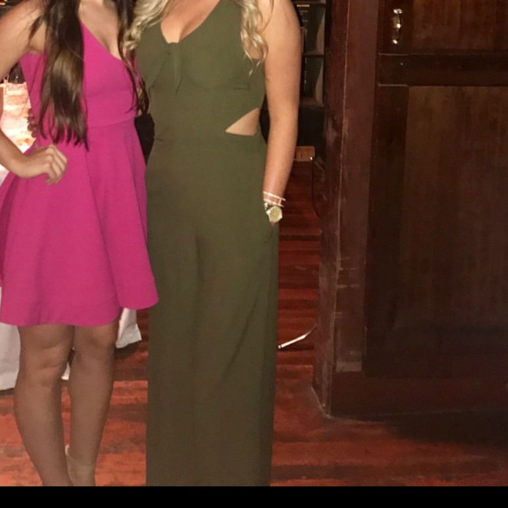Green jumpsuit. Perfect condition. Barely worn.